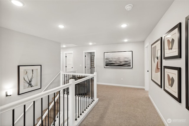 hallway featuring light carpet