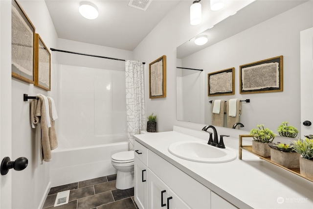 full bathroom with shower / tub combo, vanity, tile patterned floors, and toilet