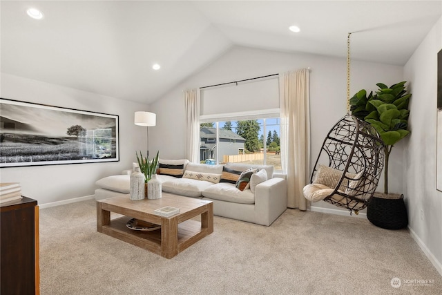 carpeted living room featuring vaulted ceiling