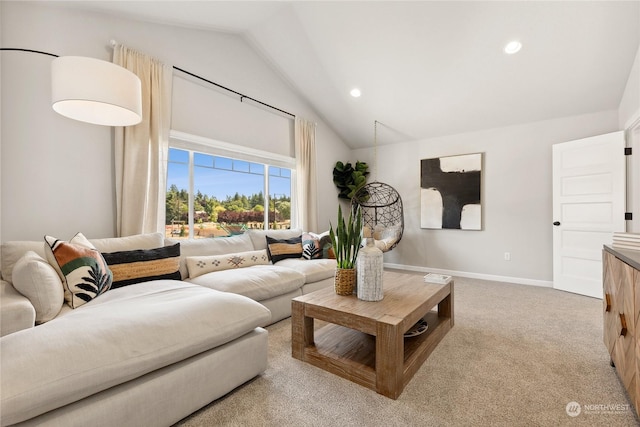 living room featuring lofted ceiling and light carpet