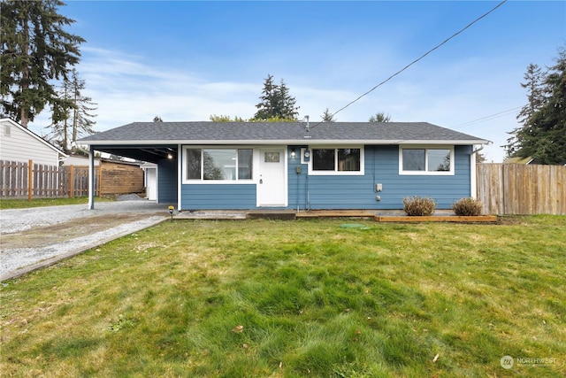 single story home featuring a front lawn and a carport