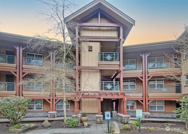 view of outdoor building at dusk