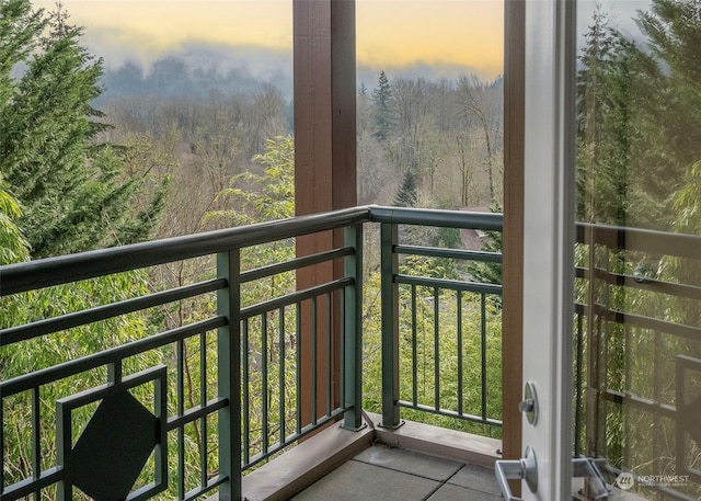 view of balcony at dusk