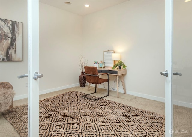 carpeted office space featuring french doors