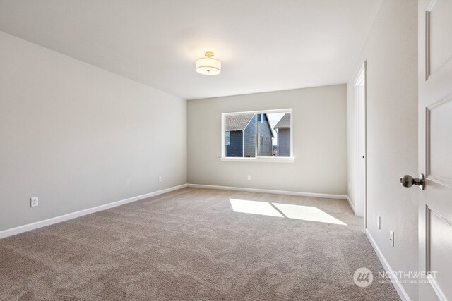 unfurnished bedroom with carpet and baseboards