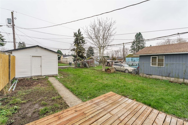 view of yard with a deck and a storage unit