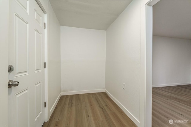 corridor featuring light hardwood / wood-style floors