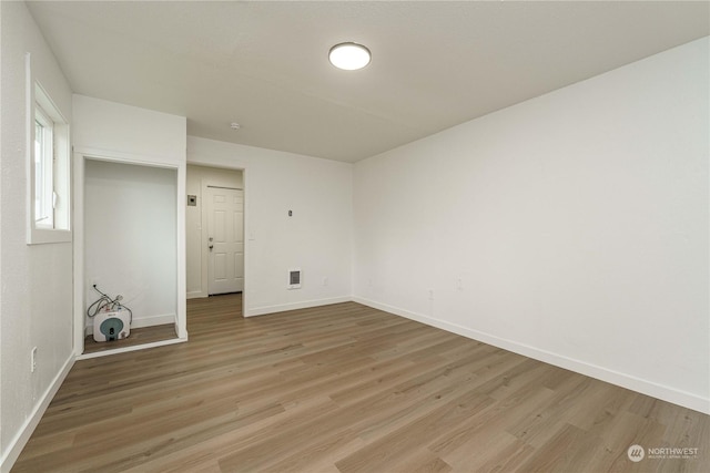 unfurnished room featuring light hardwood / wood-style flooring