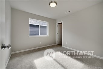 unfurnished room featuring carpet floors