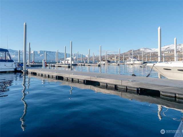 dock area featuring a water and mountain view