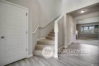 stairs with wood-type flooring