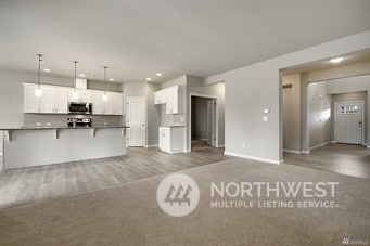 unfurnished living room with dark hardwood / wood-style floors