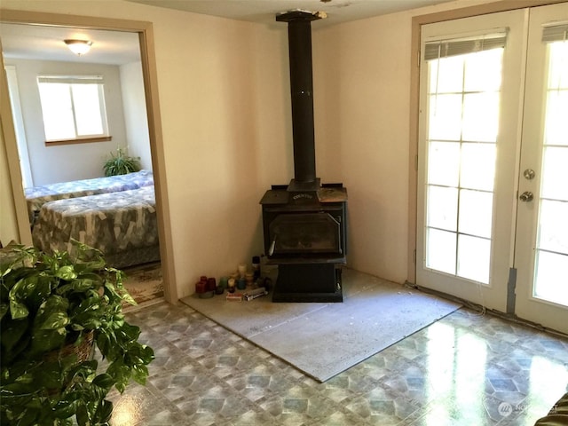 room details with french doors and a wood stove