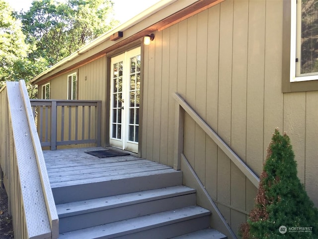 exterior space with a wooden deck and french doors