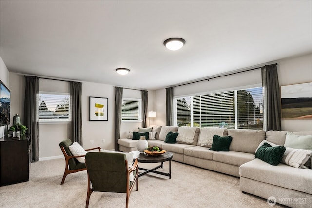 living room with light colored carpet and baseboards