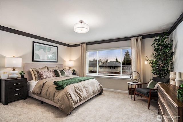 bedroom with light carpet, baseboards, and crown molding