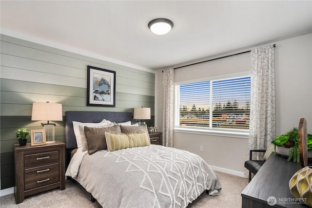 bedroom featuring carpet flooring and baseboards