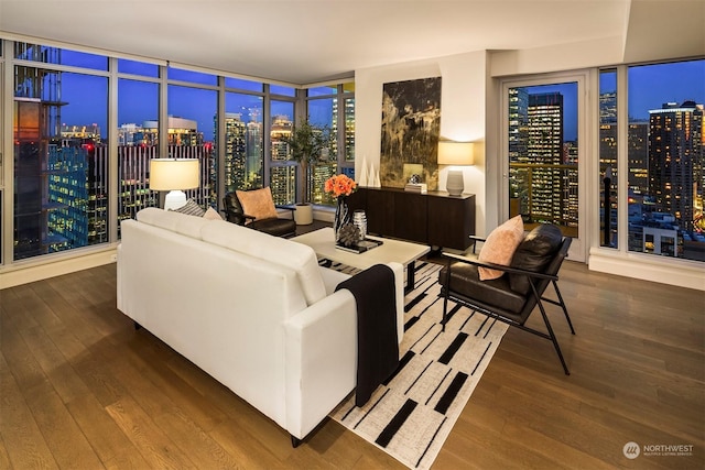 living room featuring floor to ceiling windows and dark hardwood / wood-style floors