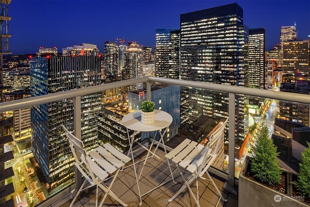 view of balcony at twilight