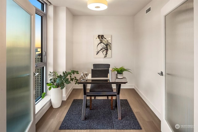 office with dark hardwood / wood-style floors