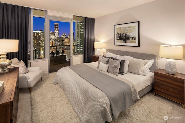 carpeted bedroom featuring access to outside