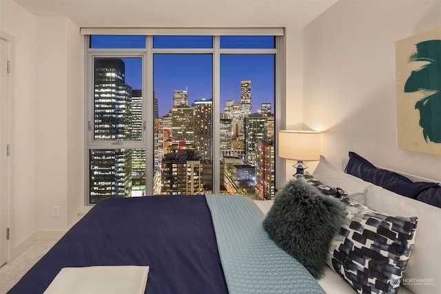 carpeted bedroom with expansive windows