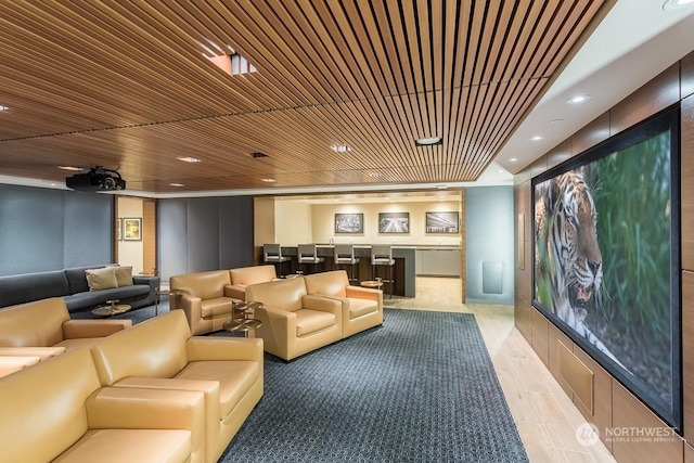 home theater featuring wooden ceiling and bar