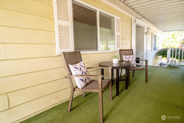 view of patio featuring a porch