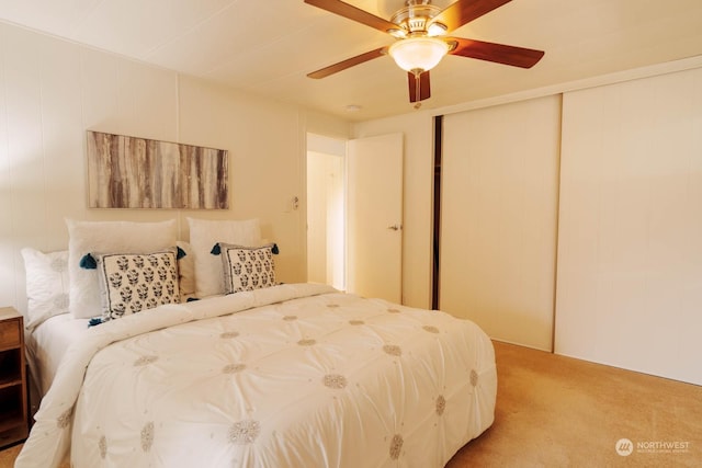 bedroom featuring ceiling fan, carpet floors, and a closet