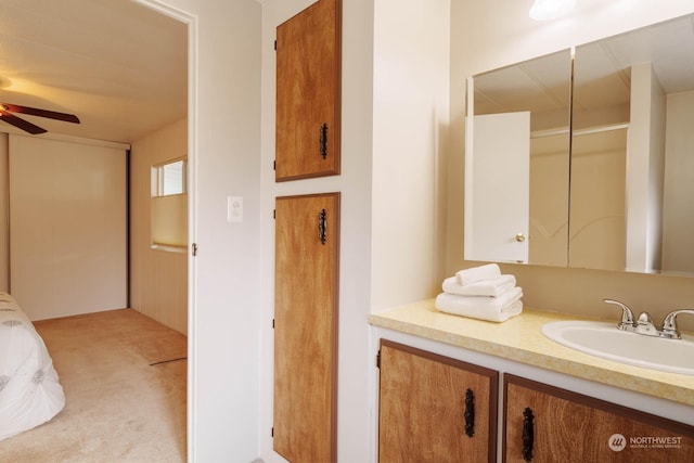 bathroom with ceiling fan and vanity