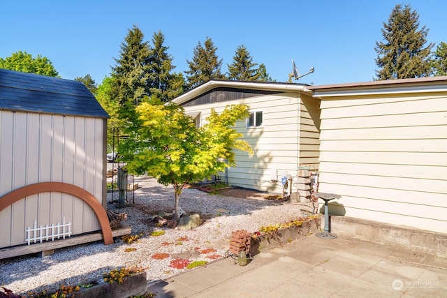 exterior space with a shed