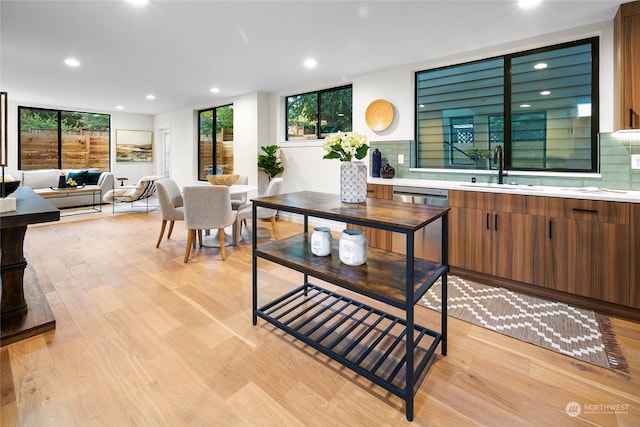 interior space with light hardwood / wood-style floors and sink