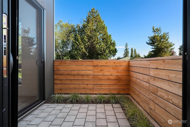 view of patio featuring a balcony