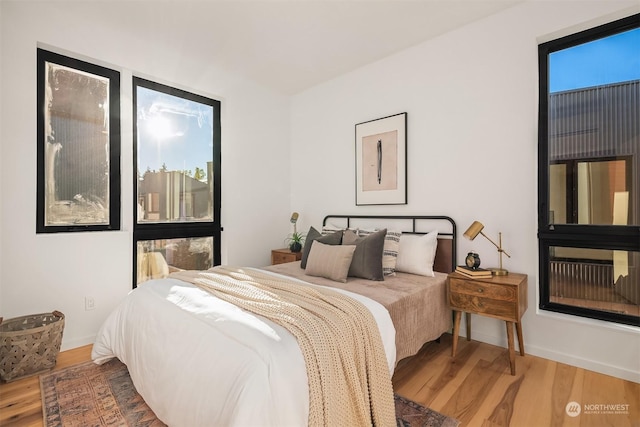 bedroom with hardwood / wood-style flooring