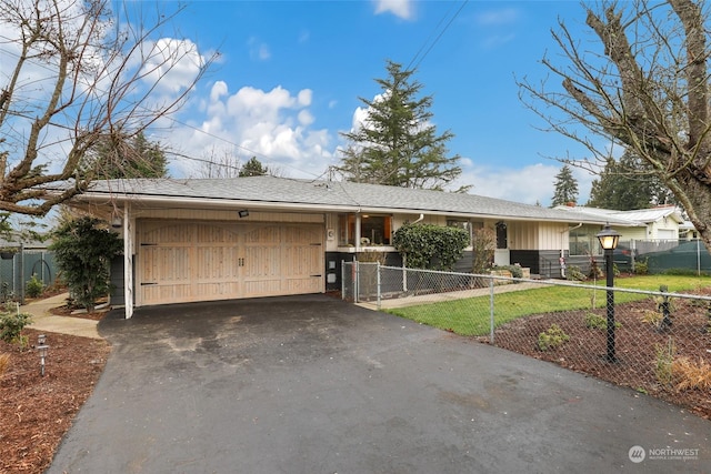 single story home featuring a front lawn and a garage