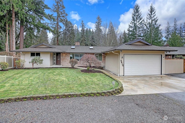 ranch-style home featuring a front lawn and a garage