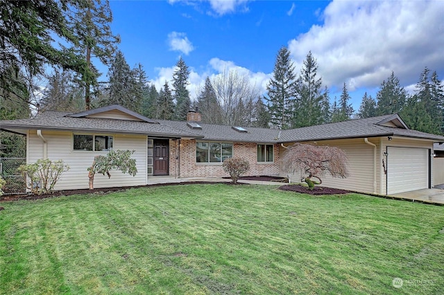 single story home with a front yard and a garage