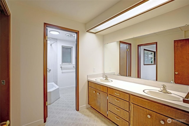 bathroom featuring a bathing tub and vanity