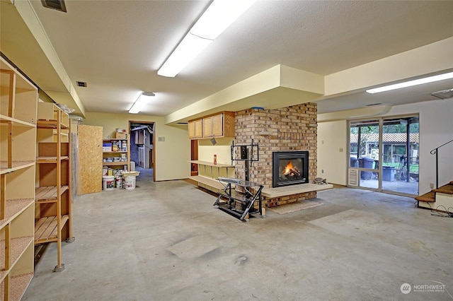 basement with a brick fireplace