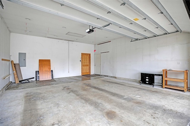 garage with electric panel and a garage door opener