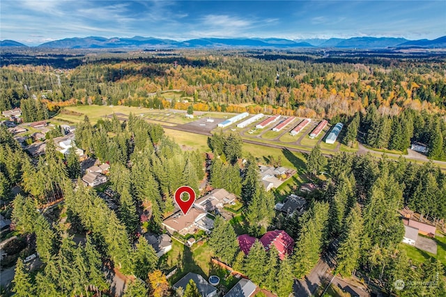 birds eye view of property featuring a mountain view