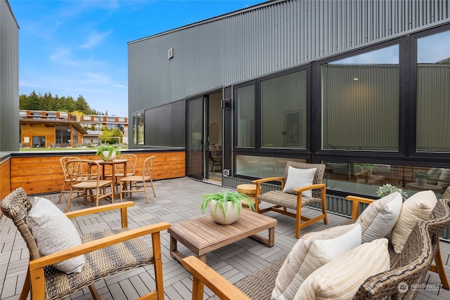 wooden terrace featuring outdoor lounge area