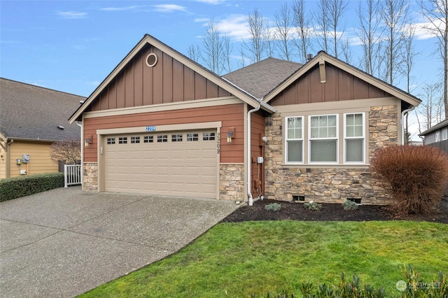 craftsman inspired home with a front yard and a garage