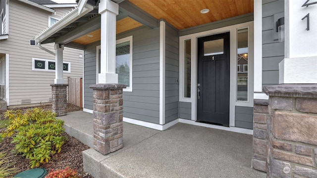 entrance to property featuring covered porch