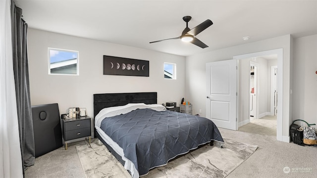 bedroom with ceiling fan and light colored carpet