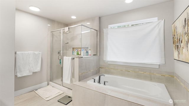 bathroom with separate shower and tub