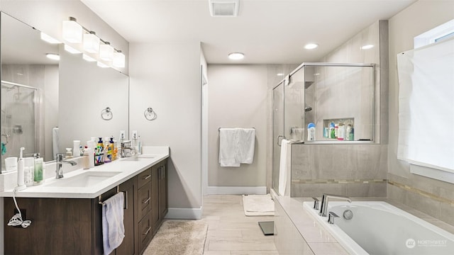 bathroom featuring independent shower and bath and vanity