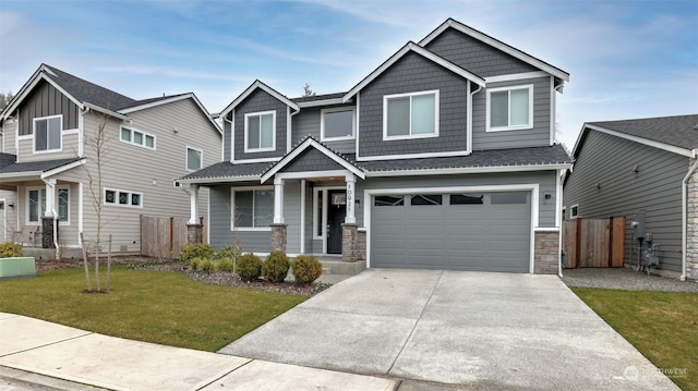 craftsman inspired home featuring a garage and a front yard