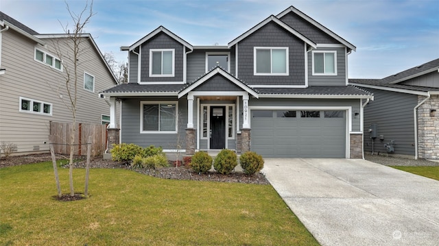 craftsman-style home featuring a front yard and a garage