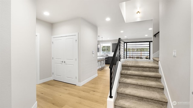 staircase featuring hardwood / wood-style flooring